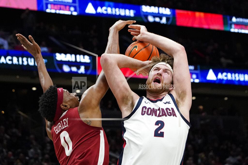 Elaine Thompson Alabama's Noah Gurley (0) knocks away a shot by Gonzaga's Drew Timme (2) during the first half of an NCAA college basketball game Saturday, Dec. 4, 2021, in Seattle. (AP Photo/Elaine Thompson)