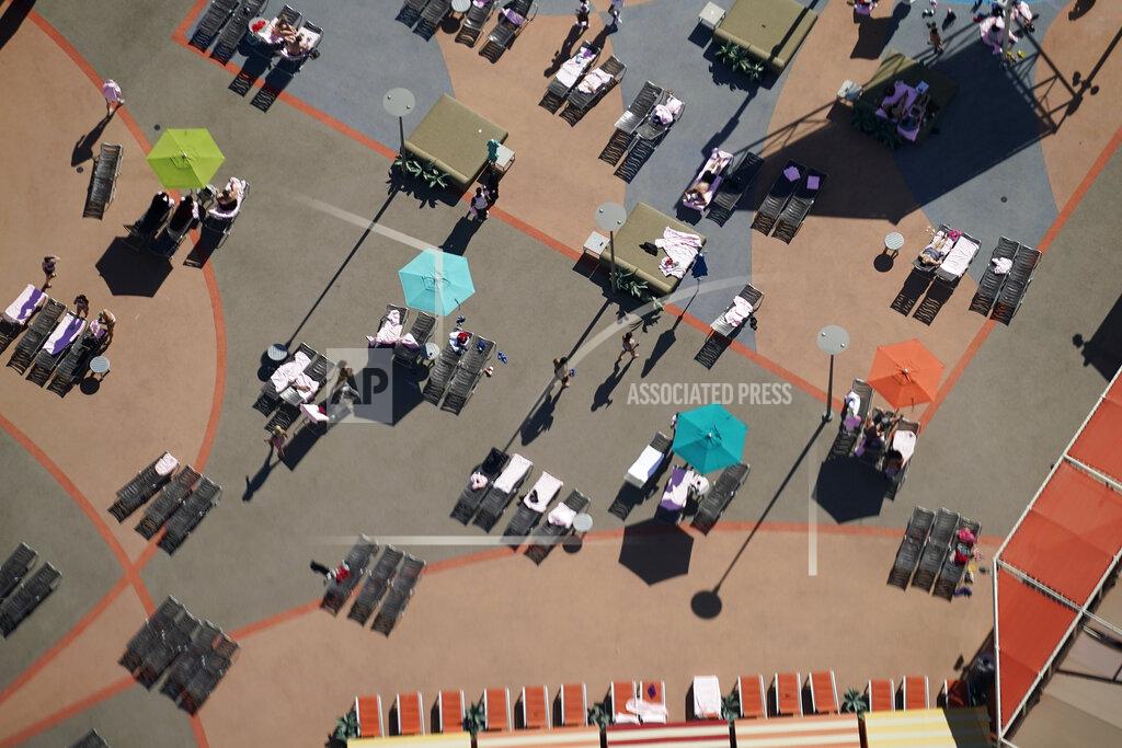 John Locher Pool chairs are spread out as a precaution against the coronavirus on the Fourth of July at the Strat hotel-casino Saturday, July 4, 2020, in Las Vegas. (AP Photo/John Locher)