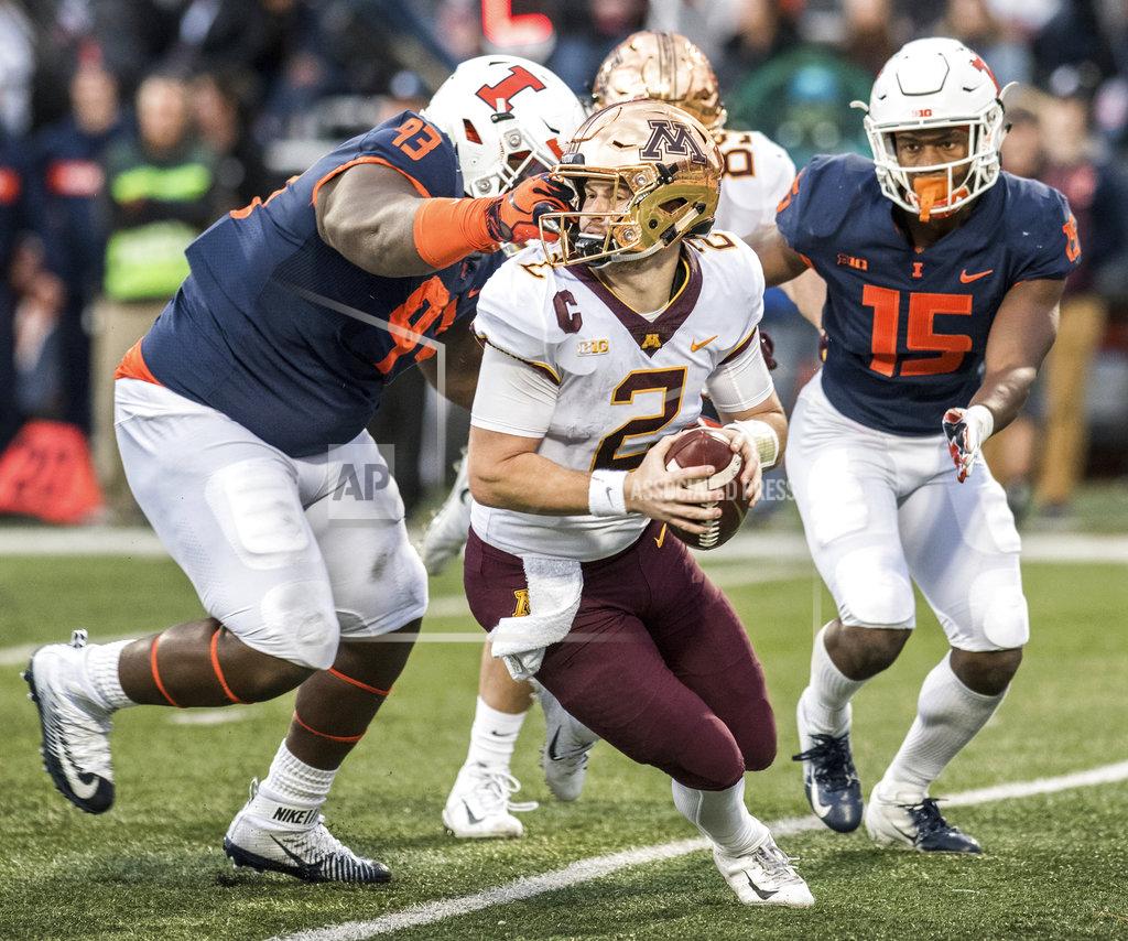 Holly Hart Minnesota quarterback Tanner Morgan (2) is grabbed on the face mask by Illinois' Calvin Avery (93) in the second half of a NCAA college football game, Saturday, Nov. 3, 2018, in Champaign, Ill. (AP Photo/Holly Hart)
