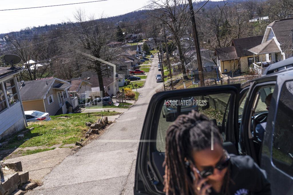 David Goldman Larrecsa Cox, who leads the Quick Response Team that tries to track down everyone who overdoses to offer help, arrives in a neighborhood to visit a client who recently overdosed in Huntington, W.Va., Friday, March 19, 2021. The team was born amid a horrific crescendo of America's addiction epidemic: On the afternoon of August 15, 2016, 28 people overdosed in four hours in Huntington. Almost everyone who overdosed that afternoon was saved, but no one was offered help navigating the bewildering treatment system. One of them, a 21-year-old woman, overdosed again 41 days later. That time she died. (AP Photo/David Goldman)
