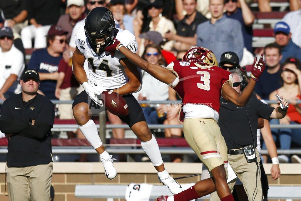 Michael Dwyer Wake Forest wide receiver Sage Surratt (14) can not make the catch against Boston College defensive back Jason Maitre (3) during the first half of an NCAA college football game in Boston, Saturday, Sept. 28, 2019. (AP Photo/Michael Dwyer)