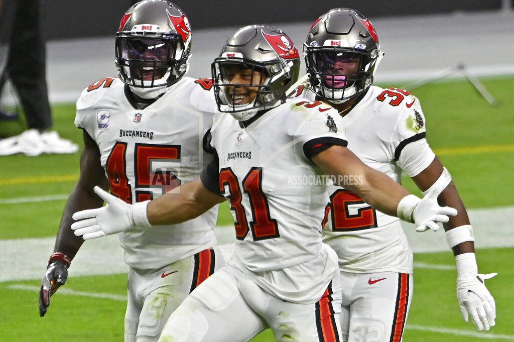 David Becker Tampa Bay Buccaneers strong safety Antoine Winfield Jr. (31) celebrates with teammates after a play against the Las Vegas Raiders during the second half of an NFL football game, Sunday, Oct. 25, 2020, in Las Vegas. (AP Photo/David Becker)