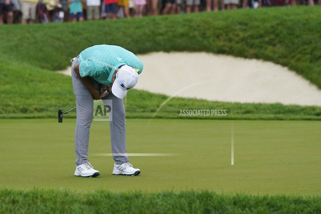 Darron Cummings Collin Morikawa reacts after missing a putt on the first playoff hole during the final round of the Memorial golf tournament, Sunday, June 6, 2021, in Dublin, Ohio. (AP Photo/Darron Cummings)