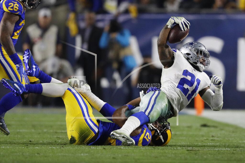 Marcio Jose Sanchez Dallas Cowboys running back Ezekiel Elliott is tackled by Los Angeles Rams cornerback Aqib Talib during the first half in an NFL divisional football playoff game Saturday, Jan. 12, 2019, in Los Angeles. (AP Photo/Marcio Jose Sanchez)