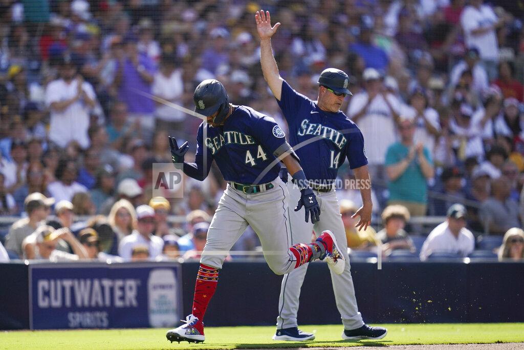 Gregory Bull Seattle Mariners' Julio Rodriguez, left, reacts with third base coach Manny Acta after hitting a two-run home run during the fourth inning of a baseball game against the San Diego Padres, Monday, July 4, 2022, in San Diego. (AP Photo/Gregory Bull)