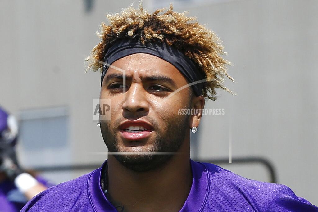 Jim Mone FILE - In this July 23, 2019, file photo, Minnesota Vikings tight end Irv Smith Jr. takes part in NFL football team training camp in Eagan, Minn. The Vikings have thrust their second-round draft pick into their tight end-heavy offense, carefully evaluating Irv Smith Jr. in training camp to see what he'll be capable of handling during a rookie season that always comes with a steep learning curve. (AP Photo/Jim Mone, File)
