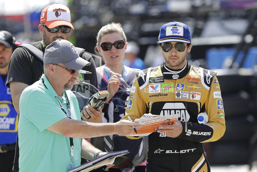 Chuck Burton Chase Elliott signs autographs as he walks through the garage area before practice for Saturday's NASCAR All-Star Cup series auto race at Charlotte Motor Speedway in Concord, N.C., Friday, May 17, 2019. (AP Photo/Chuck Burton)