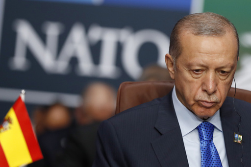 FILE - Turkish President Recep Tayyip Erdogan waits for the start of a round table meeting of the North Atlantic Council during a NATO summit in Vilnius, Lithuania, on July 11, 2023. Sweden edged closer toward joining NATO after the Turkish Parliament&rsquo;s foreign affairs committee greenlighted a protocol for the Nordic country&rsquo;s membership in the military alliance. Turkish President Recep Tayyip Erdogan dropped his objection to Sweden&rsquo;s membership during a NATO summit in July, but it took him several months to send the bill to parliament for ratification and weeks for the committee to give its consent. (AP Photo/Mindaugas Kulbis, File)