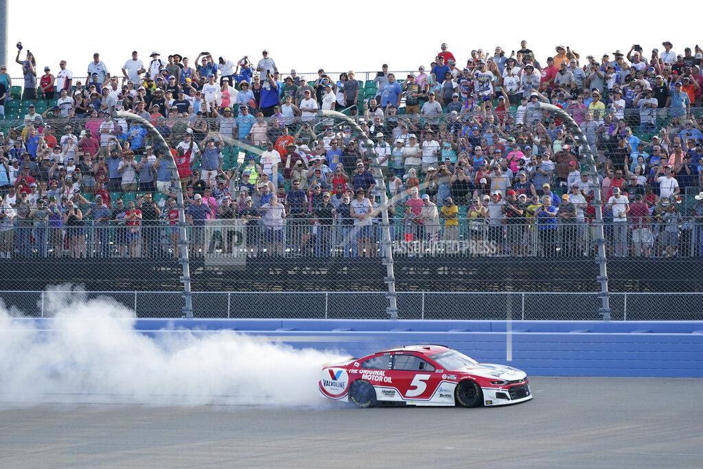 Mark Humphrey Kyle Larson (5) does a does a burnout after winning a NASCAR Cup Series auto race at Nashville Superspeedway Sunday, June 20, 2021, in Lebanon, Tenn. (AP Photo/Mark Humphrey)