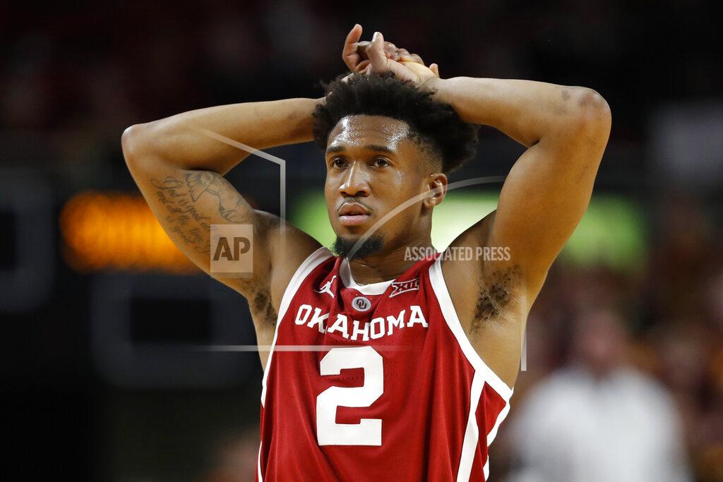 Charlie Neibergall Oklahoma guard Aaron Calixte reacts during the second half of an NCAA college basketball game against Iowa State, Monday, Feb. 25, 2019, in Ames, Iowa. Iowa State won 78-61. (AP Photo/Charlie Neibergall)