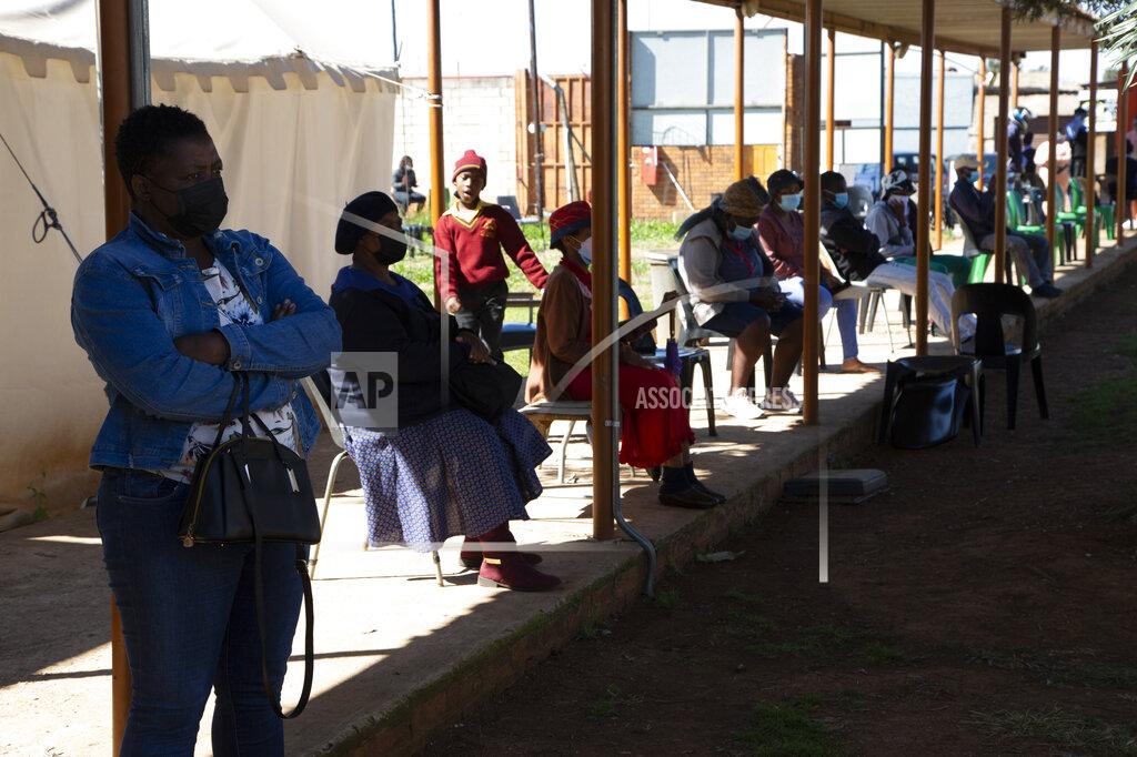 Denis Farrell People queue at a COVID-19 testing centre in Soweto, South Africa, Wednesday, May 11, 2022. Health experts in South Africa say the country is experiencing a surge of new COVID-19 cases driven by two omicron sub-variants. Professor Marta Nunes, a researcher at Vaccine and Infectious Diseases Analytics at Chris Hani Baragwanath Hospital in Soweto said that for about three weeks the country has seen increasing numbers of new cases and somewhat higher hospitalizations, but not increases in severe cases and deaths. (AP Photo/Denis Farrell)