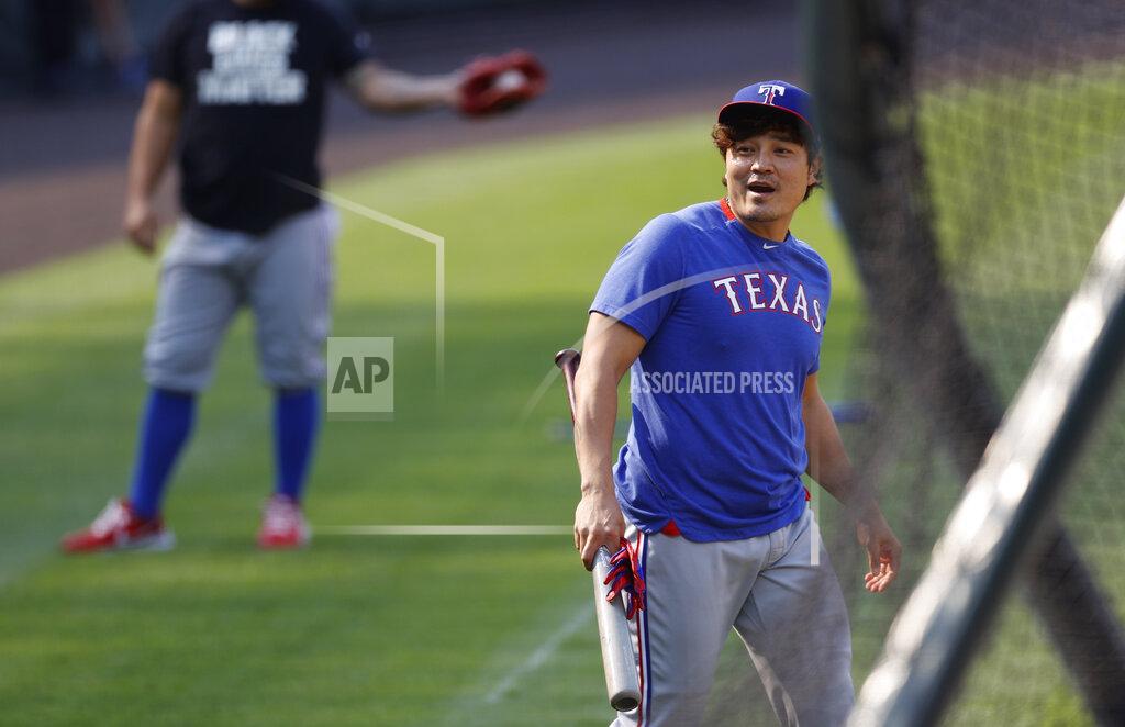 David Zalubowski Texas Rangers left fielder Shin-Soo Choo reacts after avoiding a practice throw by shortstop Elvis Andrus as he warms up before a baseball game against the Colorado Rockies Saturday, Aug. 15, 2020, in Denver. (AP Photo/David Zalubowski)