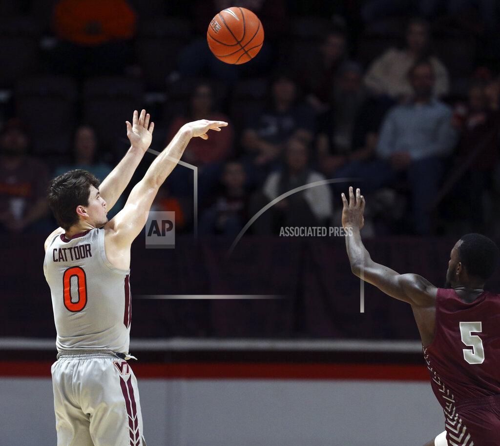 Matt Gentry Virginia Tech's Hunter Cattoor (0) shoots a three-point basket over the defense of Maryland-Eastern Shore's Da'Shawn Phillip (5) in the first half of an NCAA college basketball game in Blacksburg, Va., Sunday, Dec. 29 2019. (Matt Gentry/The Roanoke Times via AP)
