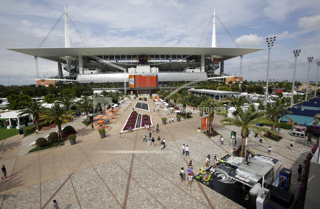 Lynne Sladky The grounds and outside courts for the Miami Open tennis tournament are viewed outside of Hard Rock Stadium, Monday, March 18, 2019, in Miami Gardens, Fla. The Miami Open has moved north from its home since 1987, the picturesque island of Key Biscayne, and will begin Tuesday at the home of the Miami Dolphins and the Miami Hurricanes. (AP Photo/Lynne Sladky)