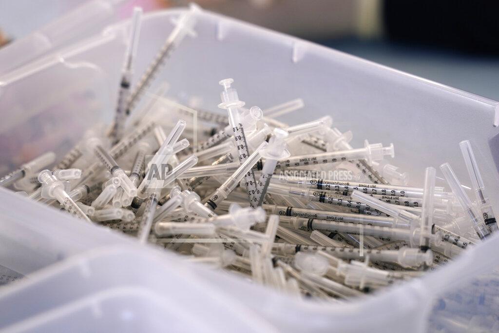 A bin of syringes sits inside a trailer Monday, March 29, 2021, as workers prepare Moderna COVID-19 vaccines at "Vaccine Fest," a 24-hour COVID-19 mass vaccination event in Metairie, La., just outside New Orleans, hosted by Ochsner Health System and the Jefferson Parish Government. Every adult in Louisiana over the age of 16 is now eligible to get vaccinated against the coronavirus as the state's expanded eligibility went into effect Monday. (AP Photo/Gerald Herbert)