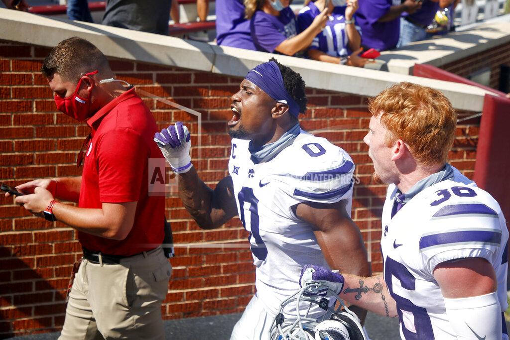Ian Maule Kansas State linebacker Elijah Sullivan (0) and defensive back Hunter Henry (36) yell while going to their locker room after a win over Oklahoma in an NCAA college football game in Norman, Okla., Saturday, Sept. 26, 2020. (Ian Maule/Tulsa World via AP)