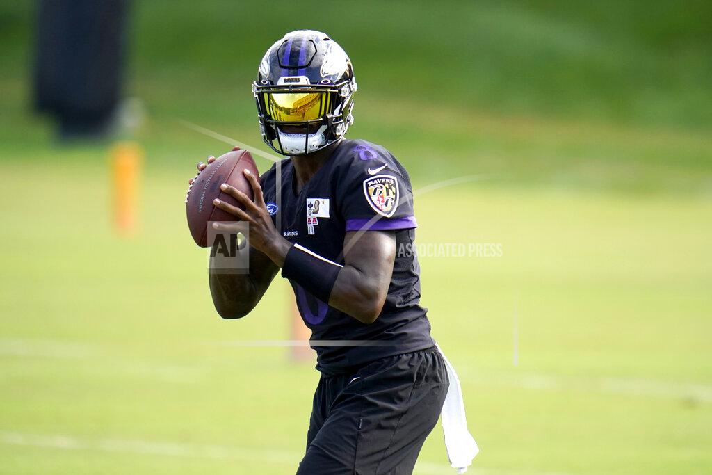 Julio Cortez Baltimore Ravens quarterback Lamar Jackson works out during an NFL football training camp practice, Monday, Aug. 24, 2020, in Owings Mills, Md. (AP Photo/Julio Cortez)