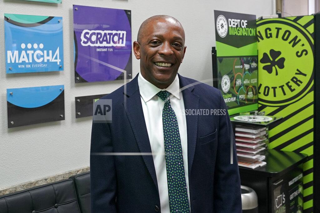 Ted S. Warren Marcus Glasper, director of the Washington State Lottery, poses for a photo, Thursday, June 3, 2021, in Olympia, Wash. Gov. Jay Inslee announced Thursday that Washington is the latest state to offer prizes to encourage people to get vaccinated against COVID-19. Incentives will include a series of giveaways during the month of June including lottery prizes totaling $2 million, college tuition assistance, airline tickets and game systems. (AP Photo/Ted S. Warren)