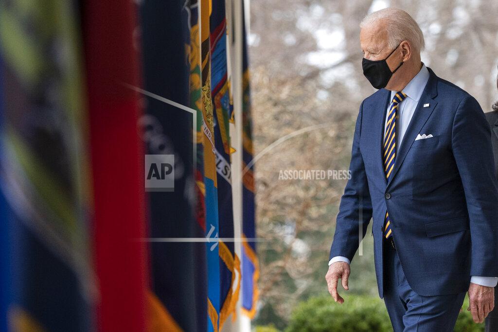 Alex Brandon FILE - In this March 12, 2021, file photo President Joe Biden walks on the Colonnade to speak about the American Rescue Plan, a coronavirus relief package, in the Rose Garden of the White House in Washington. (AP Photo/Alex Brandon, File)