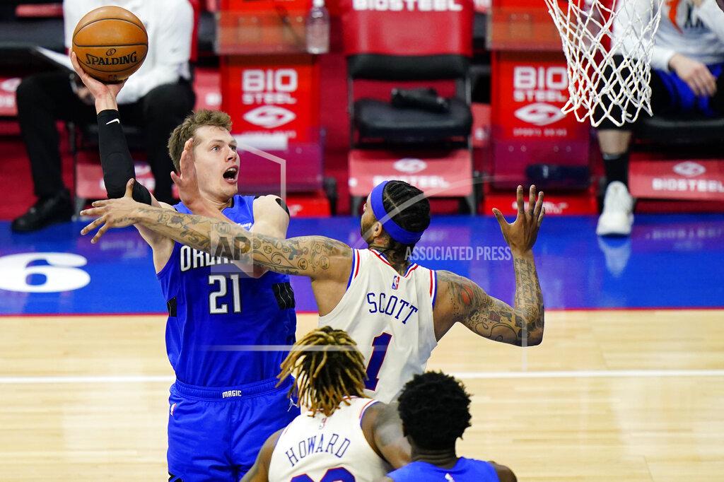 Matt Slocum Orlando Magic's Moritz Wagner (21) goes up for a shot against Philadelphia 76ers' Mike Scott (1) during the second half of an NBA basketball game, Sunday, May 16, 2021, in Philadelphia. (AP Photo/Matt Slocum)