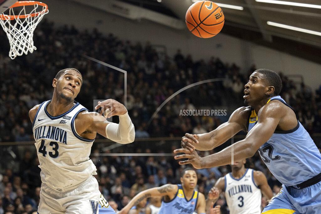Laurence Kesterson Villanova forward Eric Dixon (43) and Marquette guard Darryl Morsell (32) chase a rebound during the second half of an NCAA college basketball game, Wednesday, Jan. 19, 2022, in Villanova, Pa. (AP Photo/Laurence Kesterson)