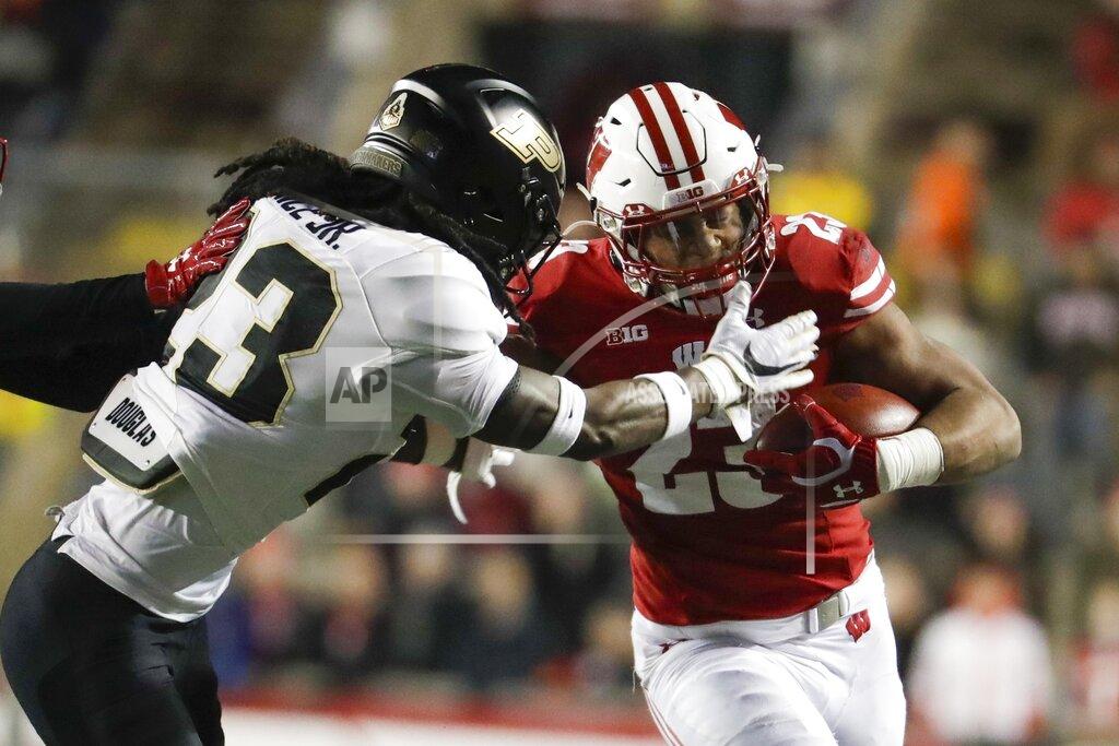 Morry Gash Wisconsin's Jonathan Taylor runs during the second half of an NCAA college football game against Purdue Saturday, Nov. 23, 2019, in Madison, Wis. (AP Photo/Morry Gash)