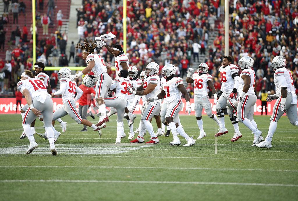 Nick Wass Ohio State players run onto the field to celebrate after an NCAA football game against Maryland, Saturday, Nov. 17, 2018, in College Park, Md. Ohio State won 52-51 in overtime. (AP Photo/Nick Wass)