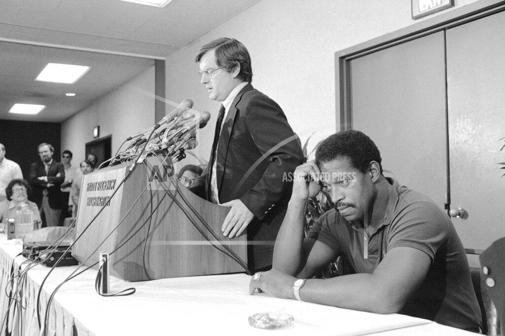 J. Scott Applewhite FILE - In this Oct. 2, 1982, file photo, Gene Upshaw, right, President of the National Football League Players Association, appears pensive as NFLPA executive director Ed Garvey speaks in Washington, after the group halted talks with NFL owners. (AP Photo/J. Scott Applewhite, File)