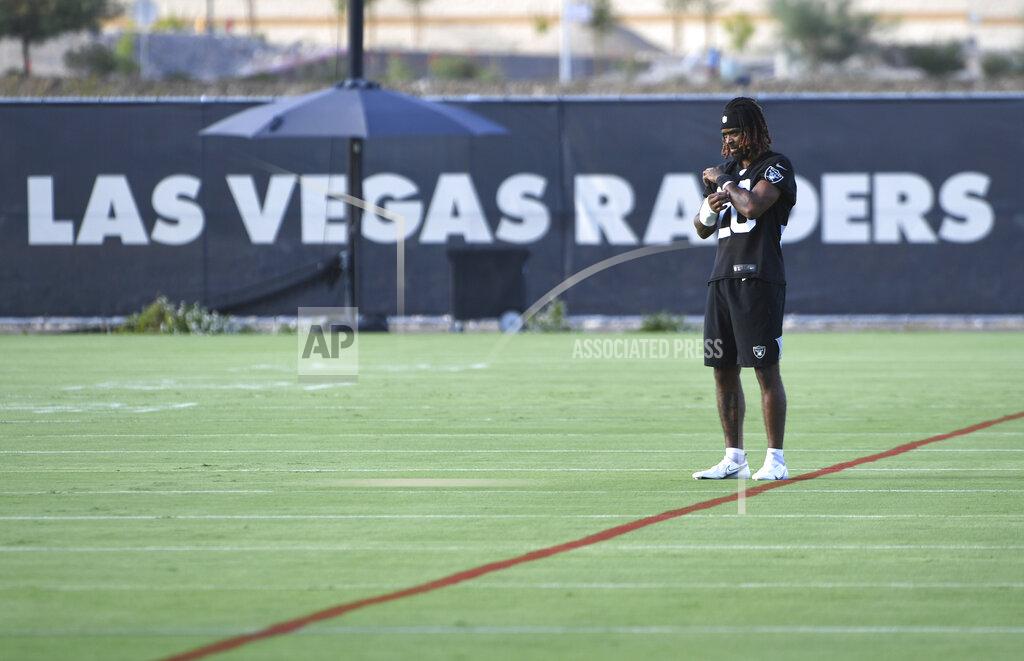 Las Vegas Raiders corner back Damon Arnette looks on during an NFL football practice Wednesday, July 28, 2021, in Henderson, Nev. (AP Photo/David Becker)