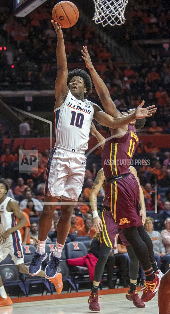 Rick Danzl Illinois guard Andres Feliz (10) shoots next to Minnesota guard Isaiah Washington (11) during the first half of an NCAA college basketball game in Champaign, Ill., Wednesday, Jan. 16, 2019. (AP Photo/Rick Danzl)