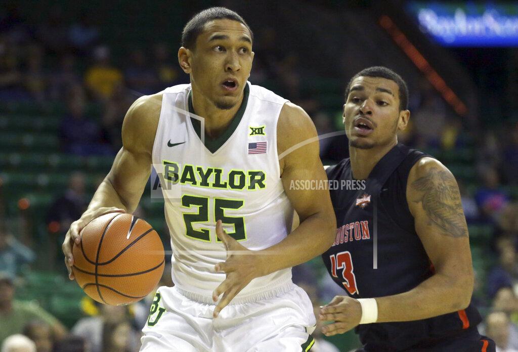 Lm Otero FILE - In this Dec. 4, 2017, file photo ,Baylor forward Tristan Clark (25) drives past Sam Houston State forward Bubba Furlong during the first half of an NCAA college basketball game in Waco, Texas. The Big 12 coaches picked Baylor to finish second in the league behind Kansas. (AP Photo/LM Otero, File)