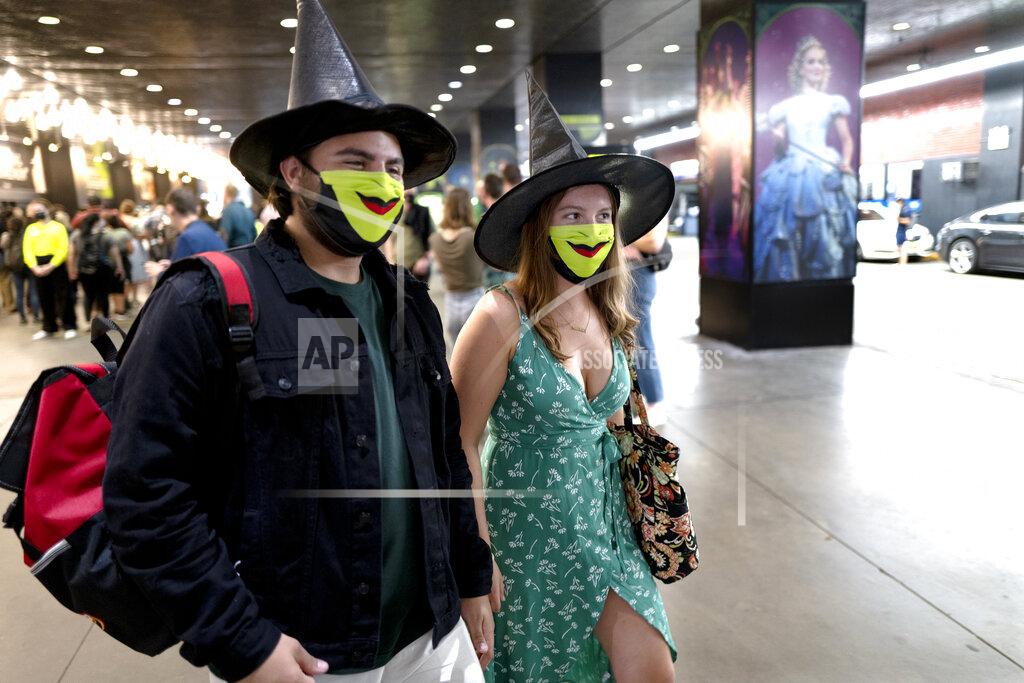 Craig Ruttle Friends Adam Schaefer and Isabella Phillips of Philadelphia attend the opening of "Wicked" at the Gershwin Theatre Tuesday, Sept. 14, 2021, in New York. The show opens after being closed due to Covid-19 concerns in early 2020. (AP Photo/Craig Ruttle)