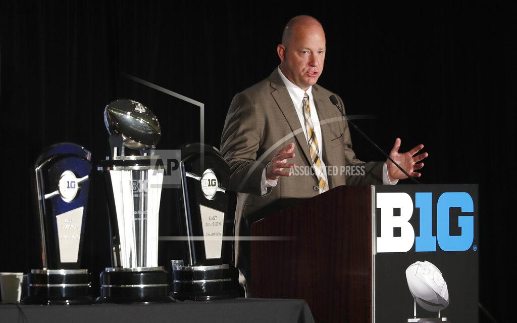 FILE - In this July 19, 2019, file photo, Purdue head coach Jeff Brohm responds to a question during the Big Ten Conference NCAA college football media days, in Chicago. Brohm believes college football can be played in the spring and next fall. And he even has a formal proposal. Just two days after the Big Ten announced it would postpone all fall sports, Brohm released a seven-page plan that calls for an eight-game conference only spring season followed by 10-game falls season. (AP Photo/Charles Rex Arbogast, File)