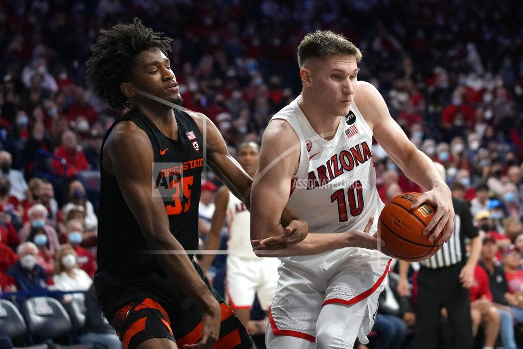 Rick Scuteri Oregon State forward Glenn Taylor Jr., left, fouls Arizona forward Azuolas Tubelis (10) during the second half of an NCAA college basketball game Thursday, Feb. 17, 2022, in Tucson, Ariz. Arizona won 83-69. (AP Photo/Rick Scuteri)