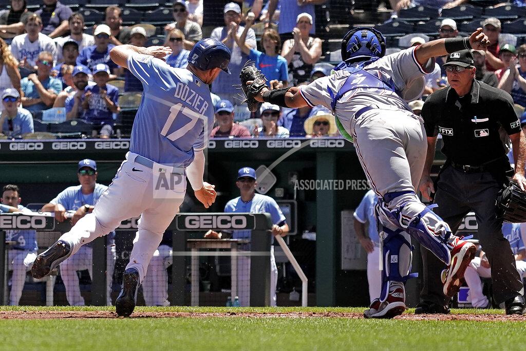 Charlie Riedel Kansas City Royals Hunter Dozier (17) is tagged out by Texas Rangers catcher Meibrys Viloria as he tried to score on a single by MJ Melendez during the first inning of a baseball game Wednesday, June 29, 2022, in Kansas City, Mo. (AP Photo/Charlie Riedel)