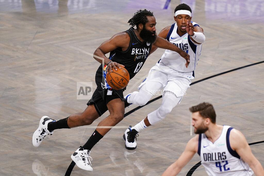 John Minchillo Brooklyn Nets guard James Harden (13) drives past Dallas Mavericks guard Josh Richardson during the second half of an NBA basketball game Saturday, Feb. 27, 2021, in New York. (AP Photo/John Minchillo)