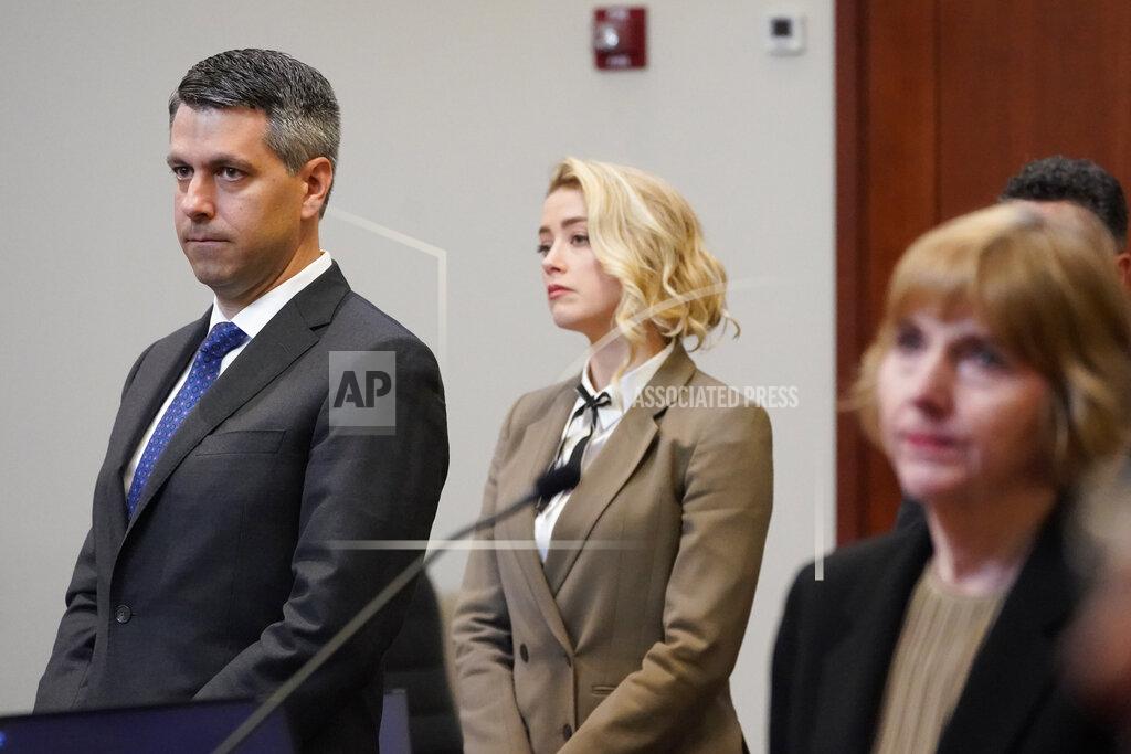 Steve Helber Actor Amber Heard watches as the jury arrives into the courtroom after a break at the Fairfax County Circuit Courthouse in Fairfax, Va., Monday, May 23, 2022. Actor Johnny Depp sued his ex-wife Amber Heard for libel in Fairfax County Circuit Court after she wrote an op-ed piece in The Washington Post in 2018 referring to herself as a "public figure representing domestic abuse." (AP Photo/Steve Helber, Pool)