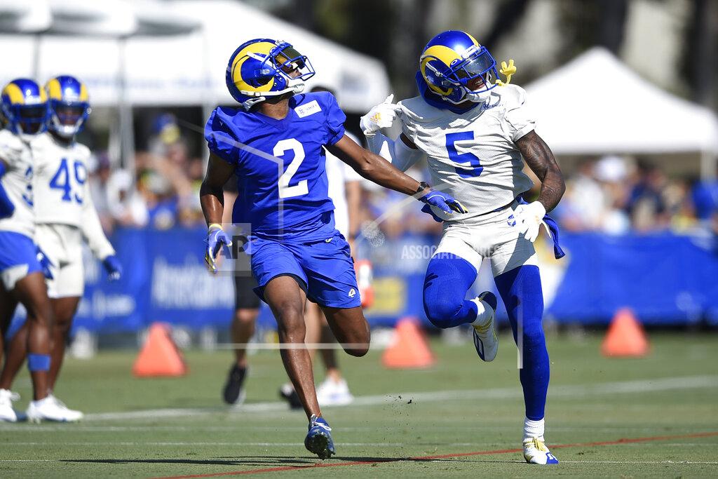Kelvin Kuo FILE - In this July 31, 2021, file photo, Los Angeles Rams wide receiver Robert Woods, left, runs one-on-one drills with cornerback Jalen Ramsey during an NFL football training camp practice in Irvine, Calif. Both players are wearing new numbers this year. Woods used to wear No. 17, while Ramsey wore No. 20. (AP Photo/Kelvin Kuo, File)