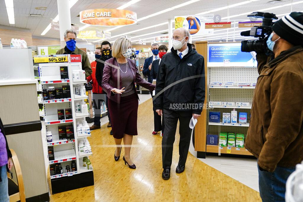 Matt Rourke Pennsylvania, Gov. Tom Wolf, center right, accompanied by Rite-Aid Chief Pharmacy Officer Jocelyn Konrad, tours a Rite-Aid pharmacy in Steelton, Pa., that is administering COVID-19 vaccinations, Friday, March 5, 2021. (AP Photo/Matt Rourke)