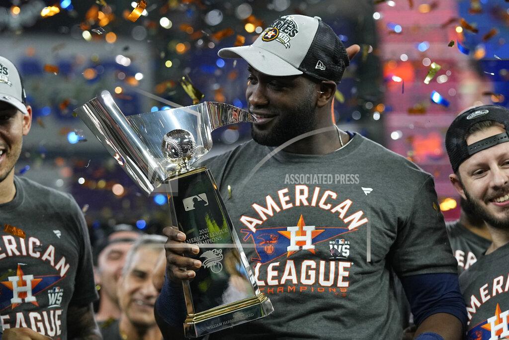 David J. Phillip Houston Astros designated hitter Yordan Alvarez holds the trophy after their win against the Boston Red Sox in Game 6 of baseball's American League Championship Series Friday, Oct. 22, 2021, in Houston. The Astros won 5-0, to win the ALCS series in game six. (AP Photo/David J. Phillip)