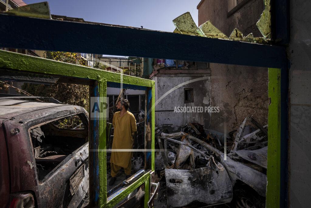 Bernat Armangue An Afghan inspects the damage of Ahmadi family house in Kabul, Afghanistan, Monday, Sept. 13, 2021. Zemerai Ahmadi, the Afghan man who was killed in a U.S. drone strike last month was an enthusiastic and beloved longtime employee at an American humanitarian organization, his colleagues say, painting a stark contrast to the Pentagon’s claims that he was an Islamic State group militant about to carry out an attack on American troops. (AP Photo/Bernat Armangue)
