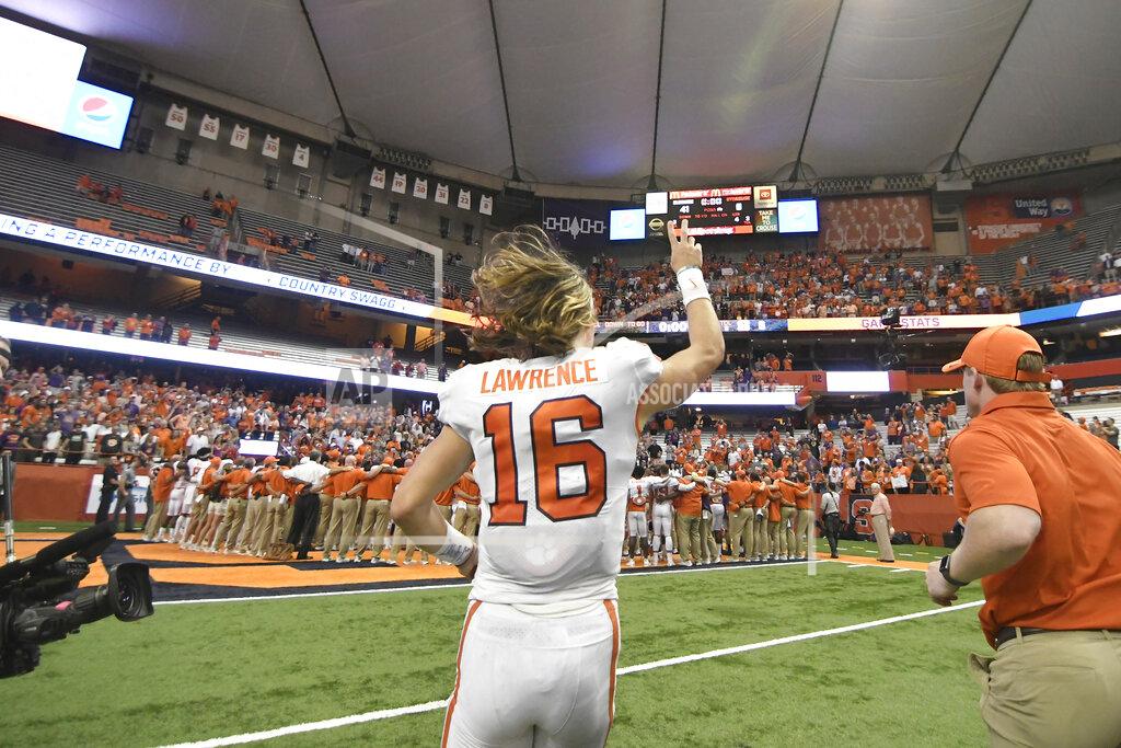 Clemson quarterback Trevor Lawrence leaves the field after the team's 41-6 win over Syracuse during an NCAA college football game Saturday, Sept. 14, 2019, in Syracuse, N.Y. (AP Photo/Steve Jacobs)