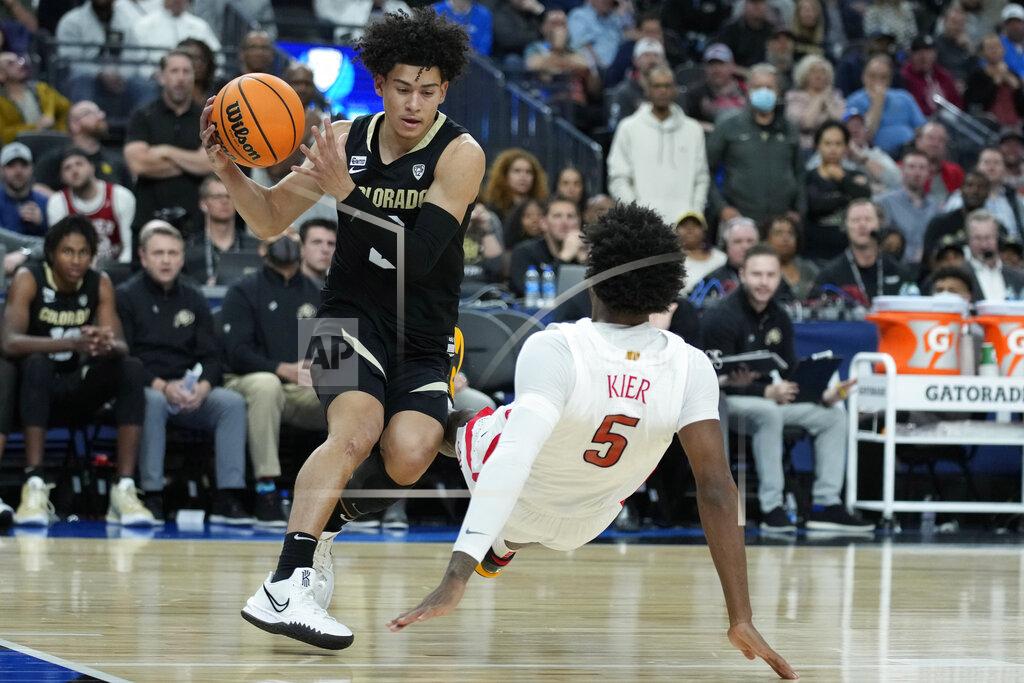 John Locher Colorado's KJ Simpson (2) fouls Arizona's Justin Kier (5) during the second half of an NCAA college basketball game in the semifinal round of the Pac-12 tournament Friday, March 11, 2022, in Las Vegas. (AP Photo/John Locher)