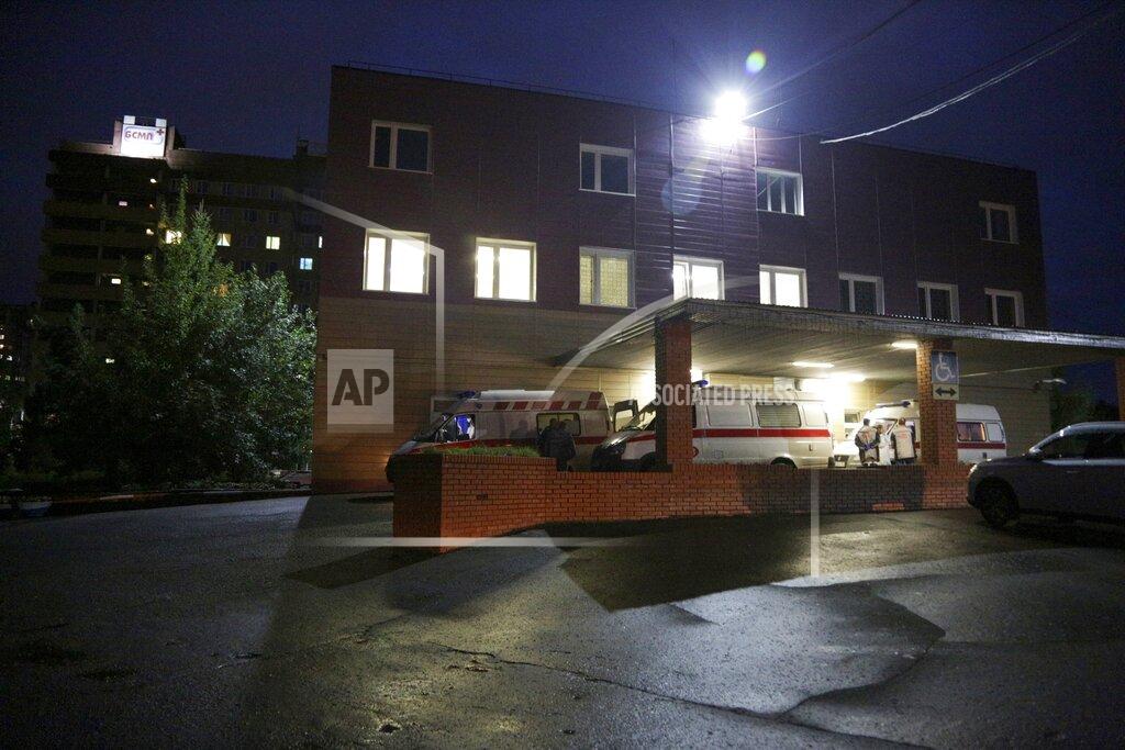 Evgeniy Sofiychuk Ambulances are parked outside the hospital intensive care unit where Alexei Navalny is hospitalized in Omsk, Russia, Thursday, Aug. 20, 2020. Russian opposition politician Alexei Navalny is on a hospital ventilator in a coma, after falling ill from a suspected poisoning, according to his spokeswoman Kira Yarmysh. (AP Photo/Evgeniy Sofiychuk)