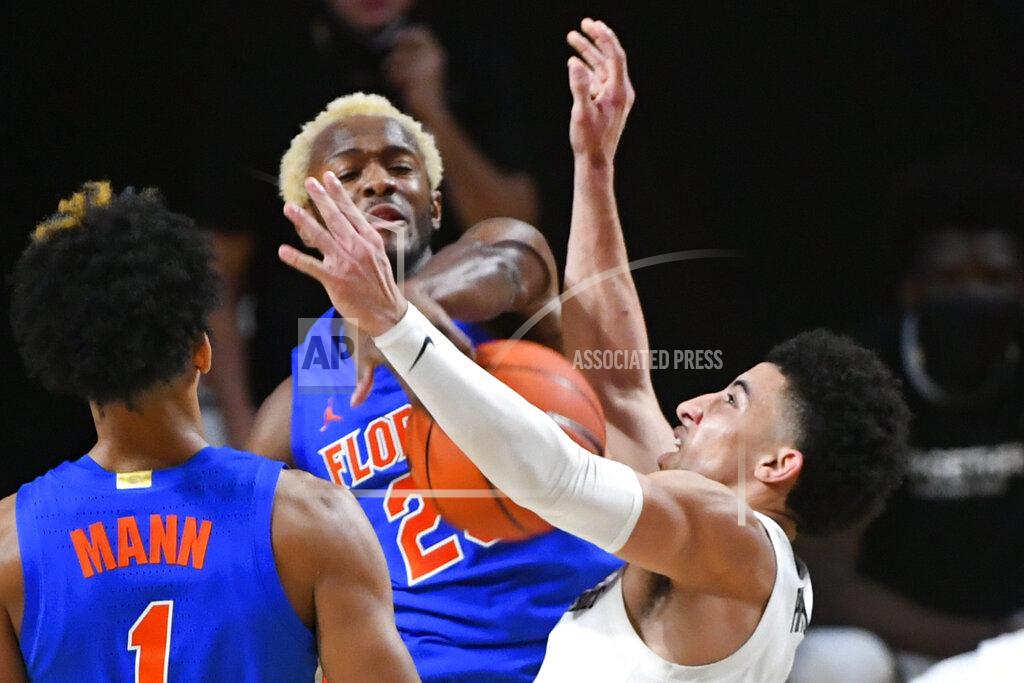 John Amis Vanderbilt guard Scotty Pippen Jr., right, has a shot blocked by Florida guard Scottie Lewis during the second half of an NCAA college basketball game Wednesday, Dec. 30, 2020, in Nashville, Tenn. (AP Photo/John Amis)