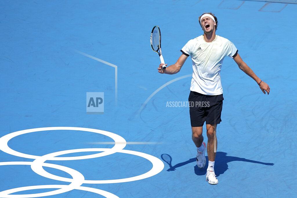Alexander Zverev, of Germany, reacts during a tennis match against Taiwan's Lu Yen-Hsun at the 2020 Summer Olympics, Sunday, July 25, 2021, in Tokyo, Japan. (AP Photo/Patrick Semansky)