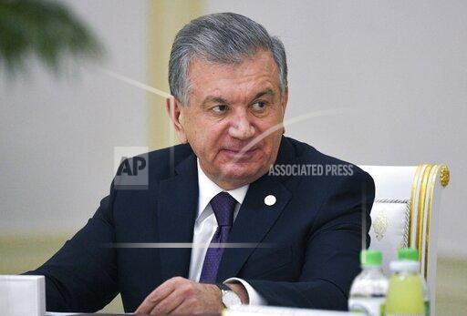 FILE - In this file Friday, Oct. 11, 2019 file photo, Uzbekistan's President Shavkat Mirziyoyev attends the meeting of the heads of CIS states in Ashgabat, Turkmenistan. Uzbekistan's president is expected to win a new term by a landslide against weak competition in an election Sunday. Shavkat Mirziyoyev has relaxed many of the policies of his dictatorial predecessor but has made little effort at political reform. (Alexei Druzhinin, Sputnik, Kremlin Pool Photo via AP, File)