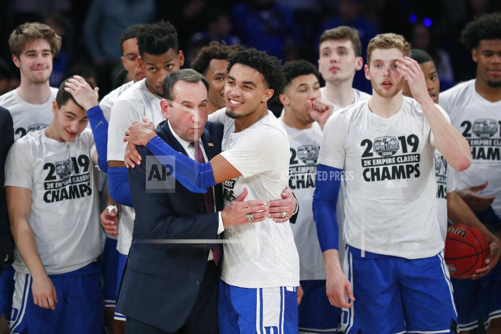 Kathy Willens Duke guard Tre Jones (3) embraces coach Mike Krzyzewski after Duke defeated Georgetown 81-73 in an NCAA college basketball game in the 2K Empire Classic, Friday, Nov. 22, 2019 in New York. (AP Photo/Kathy Willens)