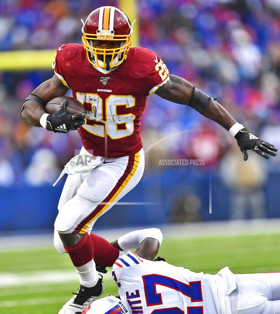 Adrian Kraus Washington Redskins running back Adrian Peterson (26) avoids a tackle by Buffalo Bills cornerback Tre'Davious White (27) during the second half of an NFL football game, Sunday, Nov. 3, 2019, in Orchard Park, N.Y. (AP Photo/Adrian Kraus)