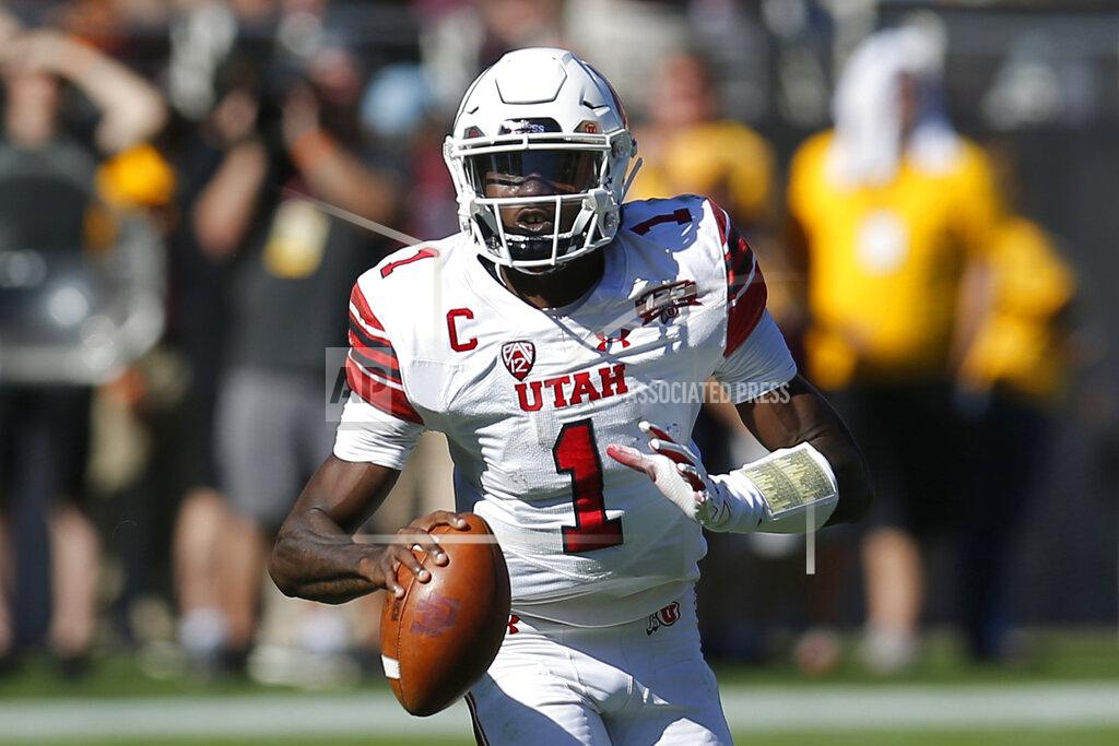 Rick Scuteri FILE - In this Nov. 3, 2018, file photo, Utah quarterback Tyler Huntley (1) is shown in the first half during an NCAA college football game against Arizona State, in Tempe, Ariz. No. 14 Utah heads into the 100th edition of the Holy War rivalry with BYU sporting a new-look offense headlined by a familiar playmaker. (AP Photo/Rick Scuteri, File)
